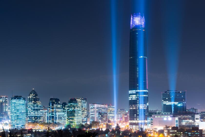 Skyline of Las Condes and Providencia districts illuminated at night, Santiago de Chile