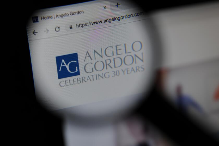 The Angelo Gordon financial website seen through a magnifying glass