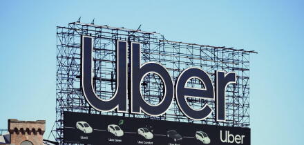 Manhattan, NY - April 9, 2023: New York City Uber car service billboard on top of building