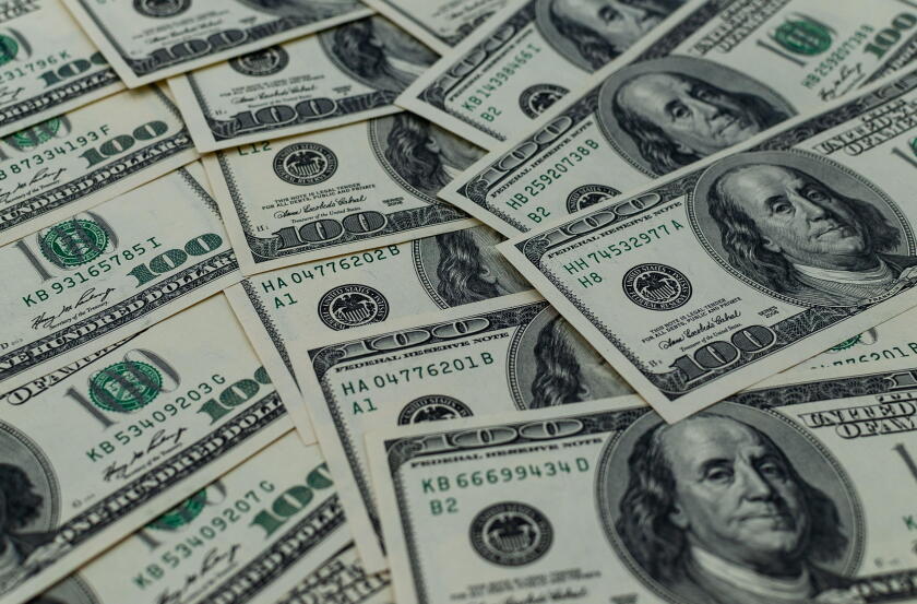 A multitude of laid-out and overlapping US hundred-dollar bills