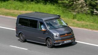 2016 grey VW Volkswagen Transporter T30 T-Ln Tdi Bmt LCV diesel panel van, driving on the M6 motorway near Preston in Lancashire, UK.