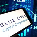 Konskie, Poland - November 24, 2024: Blue Owl Capital company logo displayed on mobile phone