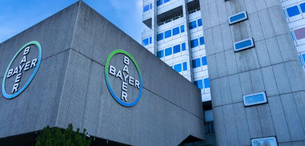 Bayer AG company logos displayed on the exterior of the division pharmaceuticals headquarters building in the Wedding district of Berlin, Germany.