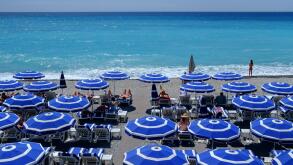 summer holiday beach umbrellas sunbathers sea sand