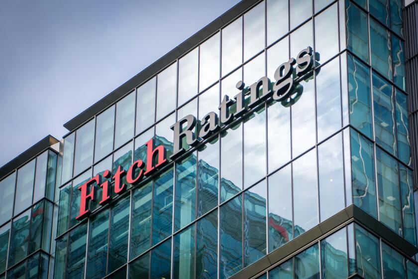 LONDON-  Fitch Ratings exterior logo in Canary Wharf, one of the 'big three' credit ratings agencies.