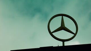 The Mercedes Benz logo on top of building Berlin Germany