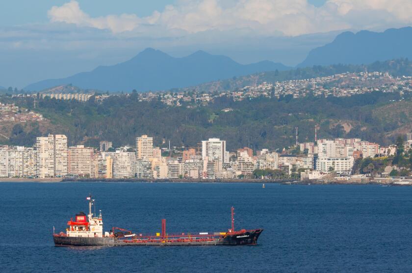Oil Products Tanker Dona Carmela on the background of Valparaiso, Chile.