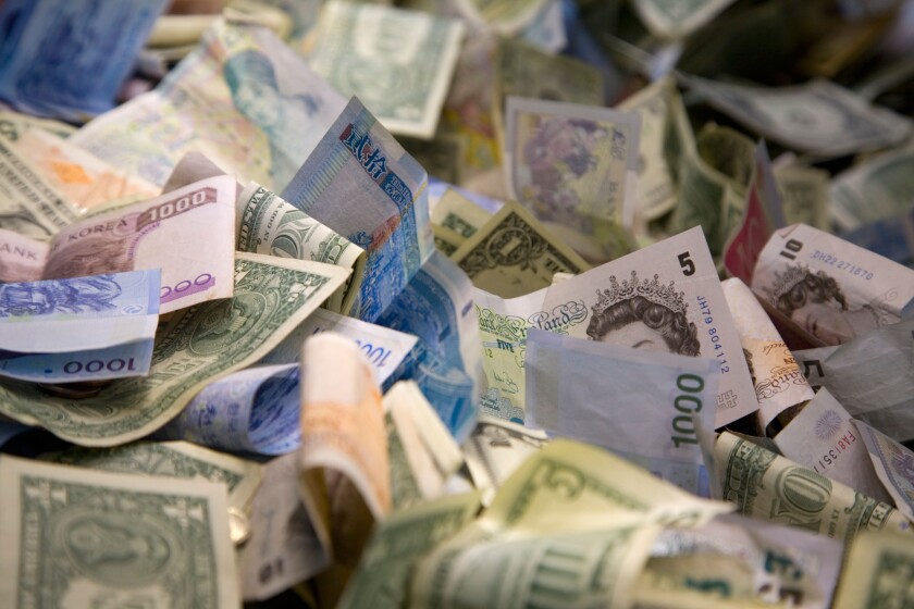 Bank notes from multiple countries in a donation box at the British Museum London England. Image shot 2007. Exact date unknown.