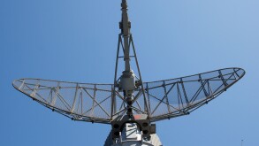 Modern military ship radar station against the sky