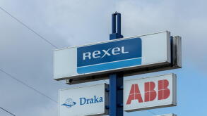 REXEL sign logo at a store. Rexel is the electrical wholesaler with electrical products for residential construction, industry, utilities.