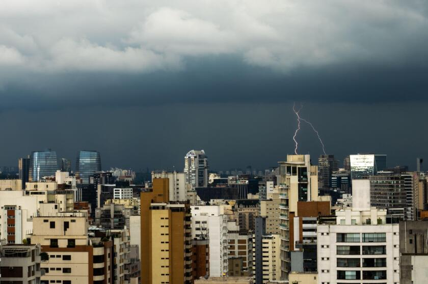 City Skyline of an afternoon lightning storm with multiple lightning bolts over the Vila Olimpia and Chacara Itaim neighboor in Sao Paulo, Brazil