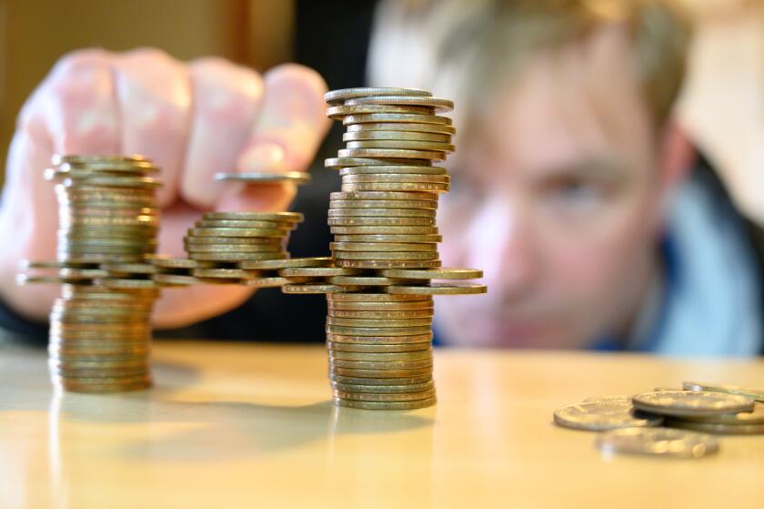 stacking gold dollar coins into bridge using a cantilever 