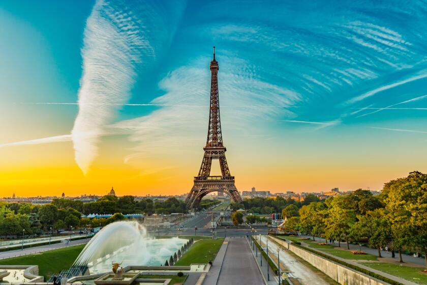 Eiffel Tower seen at sunrise from Esplanade du Trocadero in Paris.