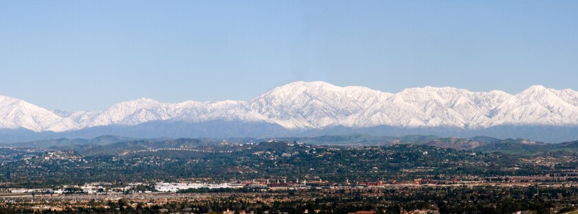 City of Tustin with rare snow capped San Bernardino mountain on the back ground.