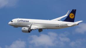 Barcelona, Spain - May 16, 2021: Lufthansa Airbus A320neo banking left after taking off from El Prat Airport in Barcelona, Spain.