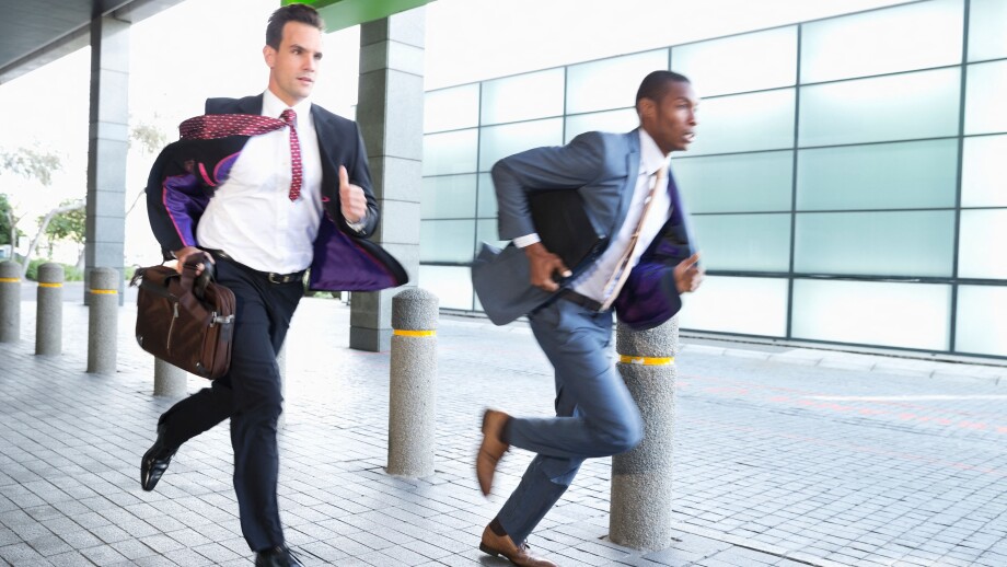 Businessmen running