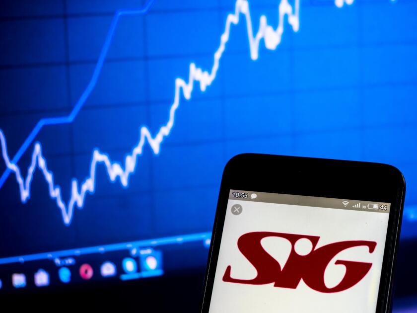 In this photo illustration a SIG plc logo seen displayed on a smart phone
