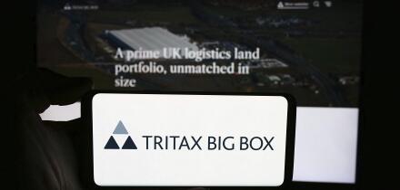 Stuttgart, Germany, 05-29-2024: Person holding cellphone with logo of British property company Tritax Big Box REIT plc in front of business webpage. F