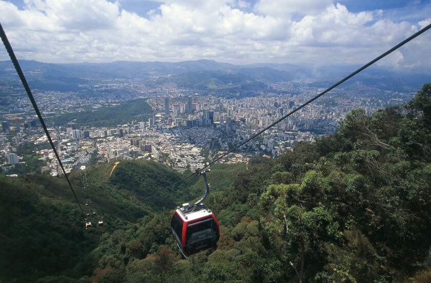 Venezuela - Caracas. The cable car in the Parque Nacional El Avila. In the background the city seen from above