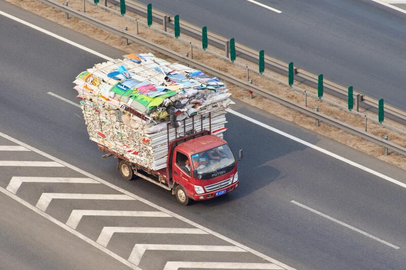 BEIJING-JULY 10, 2015. Overloaded small truck on expressway. Although China has strict traffic laws and regulations overloading is raised to culture.