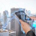 double exposure of woman hand hold and touch screen smartphone, cellphone and lowing line 5G node networking earth on world map background as business