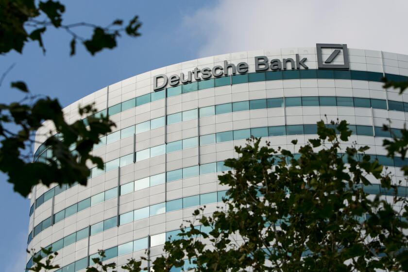 A logo sign outside of an office building occupied by Deutsche Bank in Amsterdam, Netherlands on October 4, 2015.