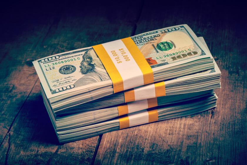 Stacks of new 100 US dollars 2013 bills banknotes