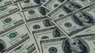 A multitude of laid-out and overlapping US hundred-dollar bills