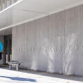 Man walks by a sign for The World Bank Group at their global headquarters in Washington, D.C.