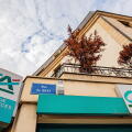Credit Agricole and Banque Assurances signs on a building corner, Bourgogne-Franche-Comte, Dijon, France