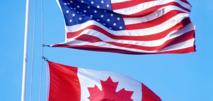 USA and Canadian Flags at the Canadian American border
