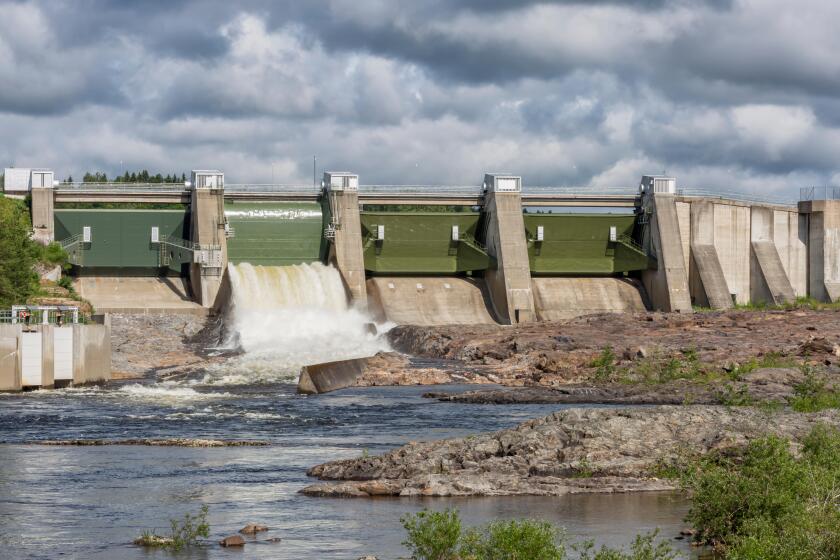 Hydropower Plant in Stornorrfors, Sweden with a cloudy sky.