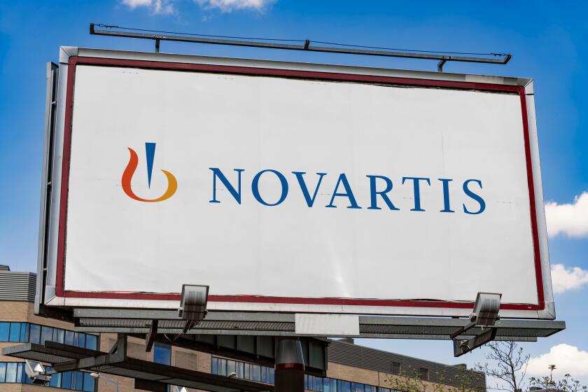 Advertisement billboard displaying logo of Novartis