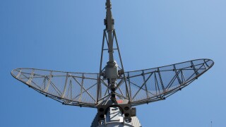 Modern military ship radar station against the sky