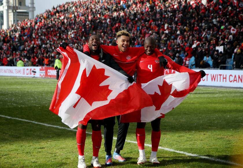 Soccer Football - World Cup - CONCACAF Qualifiers - Canada v Jamaica - BMO Field, Toronto, Canada - March 27, 2022 Canada players celebrate after qualifying to the World Cup 2022 REUTERS/Carlos Osorio