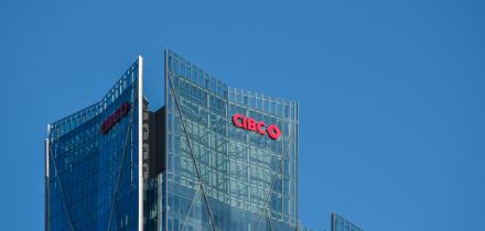 CIBC bank logo sign on a highrise glass office building downtown Toronto Ontario Canada on October 5, 2024