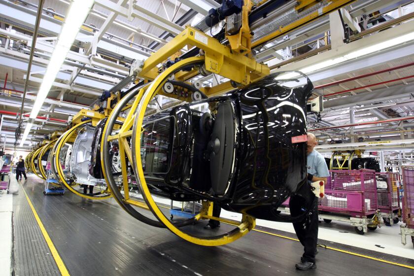 The production line at the BMW UK Mini plant in Oxford, Oxfordshire, after their 1.5 millionth car came off the production line today.