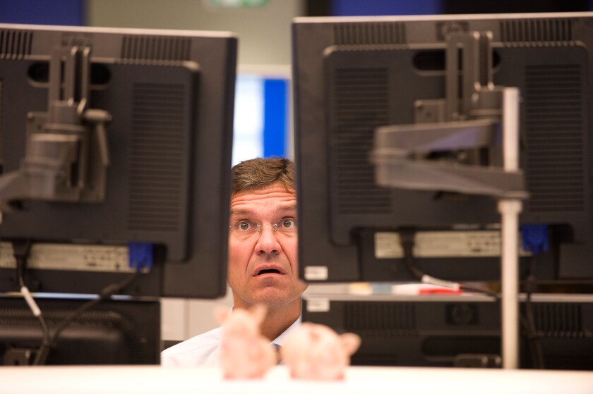 An equity trader at the screen of his computer, Frankfurt am Main, Germany