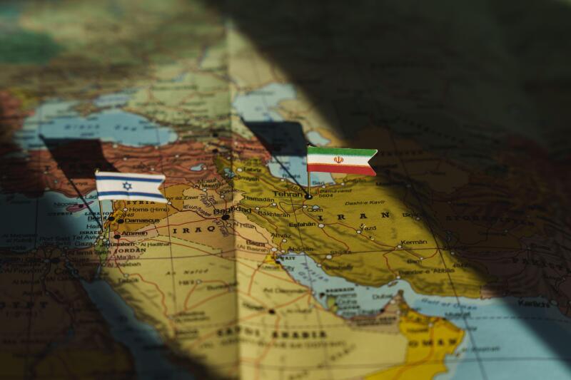 Iran and Israel flags on Middle east geopolitical map. Crisis and war between Israeli and Iran islamic republics. High quality photo