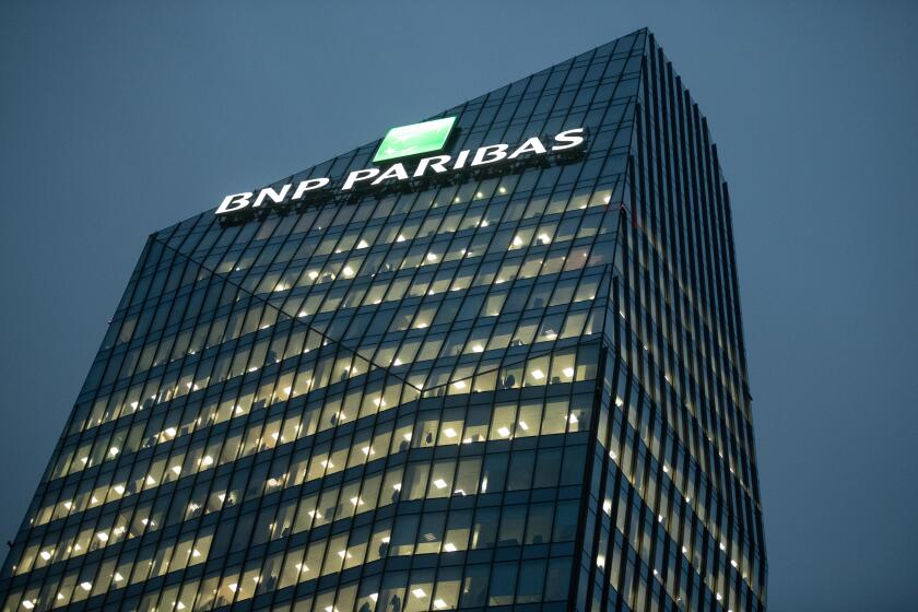 BNP Paribas headquarters office building (Diamond Tower ) at night in Milan, Italy on November 8, 2018.