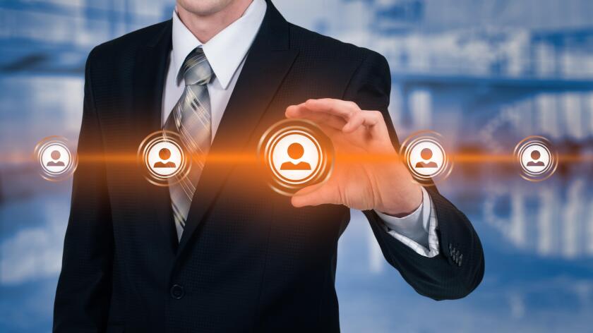 Human resource business concept. Businessman presses hr icon on virtual screen