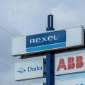 REXEL sign logo at a store. Rexel is the electrical wholesaler with electrical products for residential construction, industry, utilities.