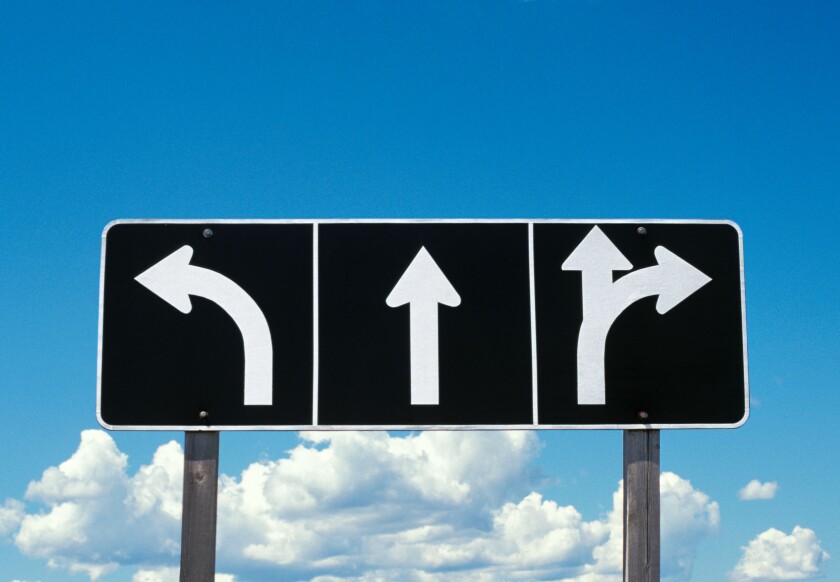 Road or traffic sign with arrows going different directions