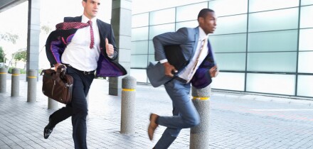 Businessmen running