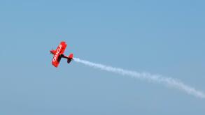 The Oracle stunt biplane climbs into the skies at the 2010 Chicago Air and Water Show.
