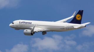 Barcelona, Spain - May 16, 2021: Lufthansa Airbus A320neo banking left after taking off from El Prat Airport in Barcelona, Spain.
