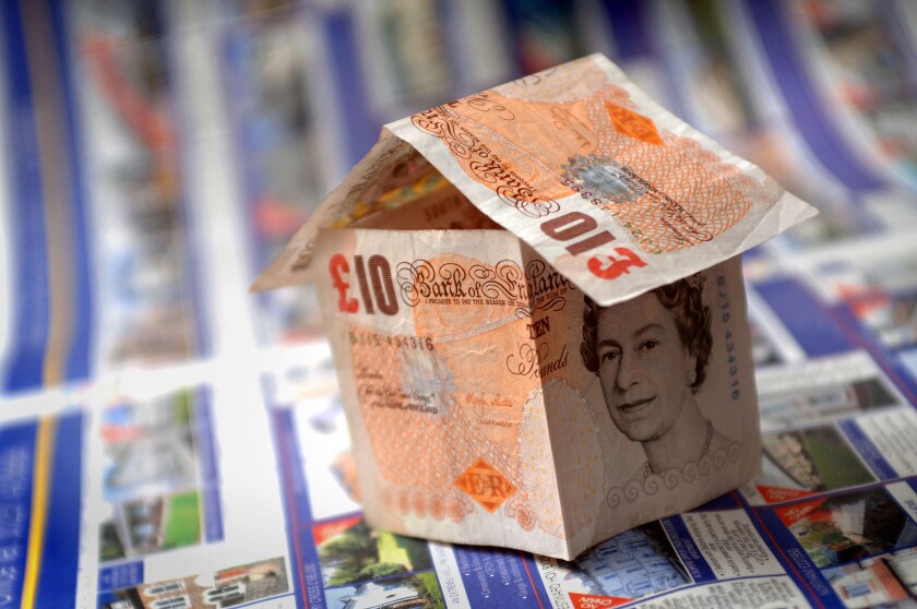 A house made out of ten pound notes to illustrate house prices in the UK. Image shot 2007. Exact date unknown.