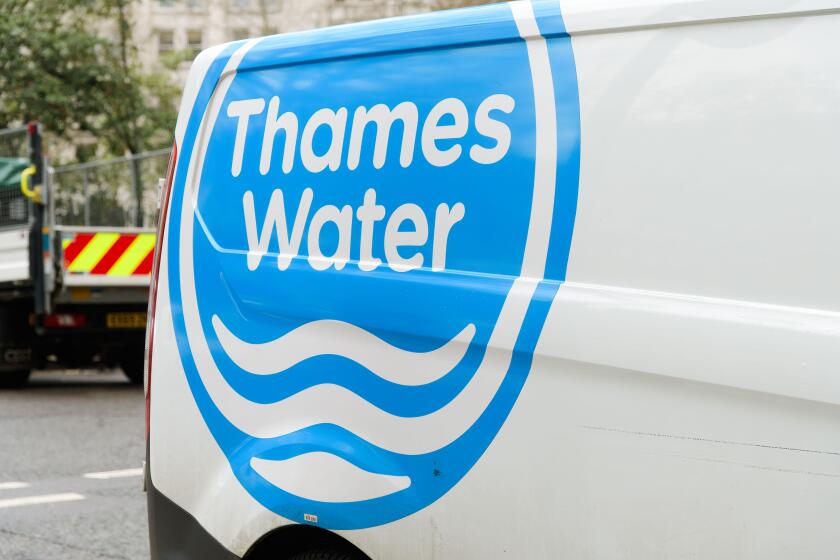 London, UK - March 16, 2023; Blue and white Thames Water logo on side of van