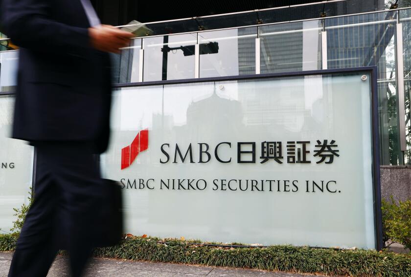 Photo taken March 24, 2022, shows a sign of SMBC Nikko Securities Inc. at its headquarters in Tokyo. Prosecutors arrested SMBC Nikko Deputy President Toshihiro Sato the same day in the latest development in the investigation into alleged market manipulati