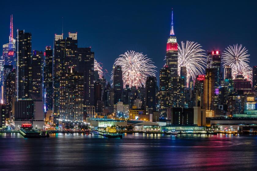 NYC 4th Of July Fireworks Celebration -  New York City skyline with the Macy's Spectacular 4th of July Fireworks Celebration Show as a backdrop to midtown Manhattan.